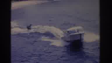 Florida USA (1962): Championship At Sea With A Boat Pulling A Surfer Where There