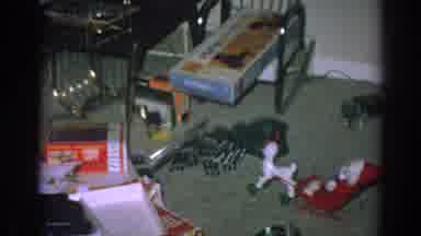 Gary Indiana (1962): Toys And Opened Christmas Gift Boxes Scattered On Green