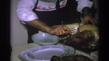Gary Indiana (1962): Man Carving A Turkey On A Table Field With Food