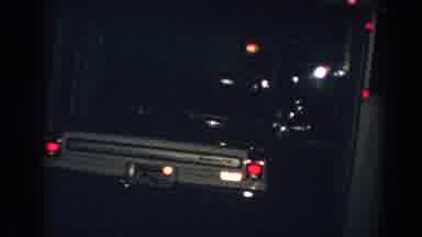 Gary Indiana (1962): A Parked Car And The Side Of A House With Christmas Lights On