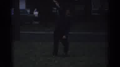 Gary Indiana (1962): Man Wearing White Shirt Teaches Small Boy How To Crack Whip