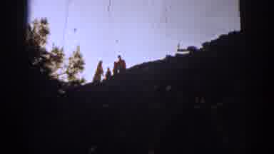 IZMIR TURKEY-1962: Camera Zooms In On Group Of People Standing On Top Of Ruins