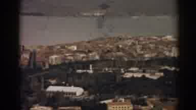 Izmir Turkey (1962): View Of Green Trees Brown Buildings And Sea On A Sunny Day