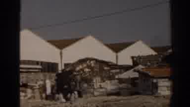 Izmir Turkey (1962): Some Poor People Living Close To A Big Building Probably In