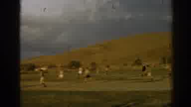 Izmir Turkey (1962): View Of People Playing Soccer Game On Green Field On A Cloudy