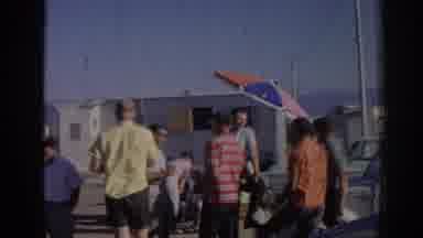Izmir Turkey (1962): Small Group Of People Stand Next To White Camper With Beach