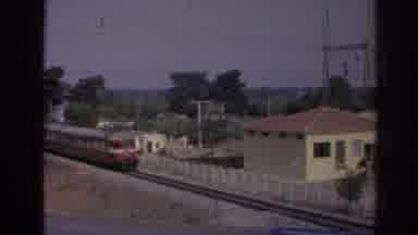 Izmir Turkey (1962): A Train Seen Approaching And Then Rolling Past View At A High