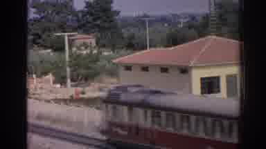 Izmir Turkey (1962): Train Driving Down A Train Track In Broad Daylight Near A