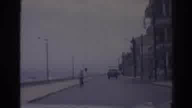 Izmir Turkey (1962): Drive Along Coastal Road While Passing Buildings And Person