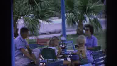 IZMIR TURKEY-1962: Family At Outdoor Café And Seaside Promenade