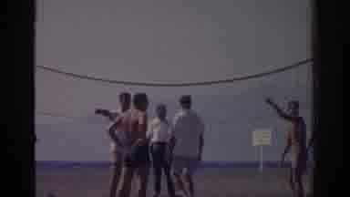 Izmir Turkey-1962: Shirtless Men Discuss Strategies To Play Beach Volleyball