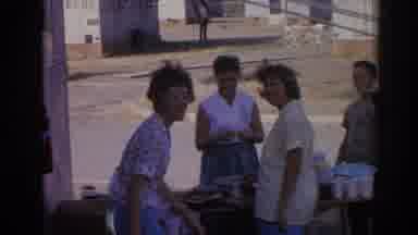 Izmir Turkey (1962): Man Wearing White Shirt Cleans Sunglasses On A Clear Day