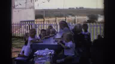 Izmir Turkey (1962): Ten Kids Sitting At Grey Picnic Table Smile At Camera Man On