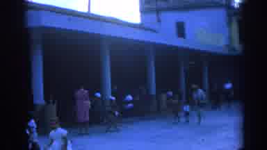 Izmir Turkey (1962): Woman Wearing White Dress Walks With Two Children Past Empty