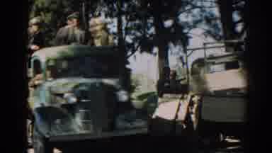 Izmir Turkey (1962): People Riding In Back Of Green Truck With Person Following On