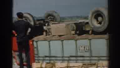 Izmir Turkey (1962): An Official And Some Men Watch Overturned Trucks On The Side