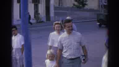 Izmir Turkey (1962): Man Wearing Green Pants Gives Small Black Object To Off