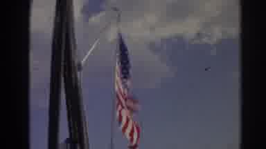 Izmir Turkey (1962): American Flag Waving In Wind Against Blue Sky And People