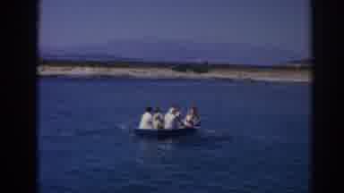 Izmir Turkey (1962): Two Boats On The Water One With Rows And The Other With A