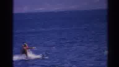 Izmir Turkey (1962): Person Wearing Orange Life jacket Water skis On A Bright