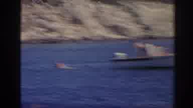 Izmir Turkey (1962): View Of White Boat And Person Swimming In Blue Lake Water On