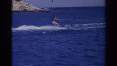 Izmir Turkey (1962): Person Wearing White Pants Water skis On A Bright Sunny Day
