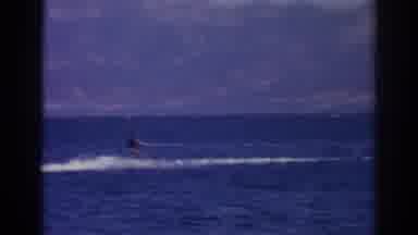 Izmir Turkey (1962): Person Riding On Jet Ski On The Ocean With Mountains In The
