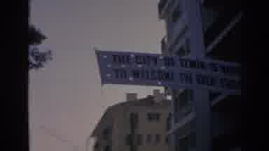 Izmir Turkey (1962): A Banner Waves As It Extends Across A Street Welcoming A Man