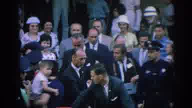 Izmir Turkey (1962): Men In Suits Surrounding A Single Man Who Is Walking To A Car