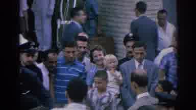 Izmir Turkey (1962): Woman With Child Waving In Waiting Crowd On The Street Police