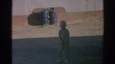 Izmir Turkey (1962): Child Spinning With Toy In Street