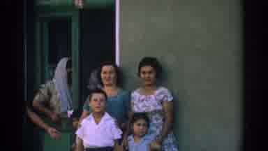 Izmir Turkey (1962): Women With Their Children Smile At A Restaurant Door