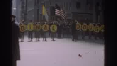 New York City (1962): A Marching Band Marches Down An Urban Street In A Parade On