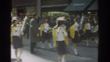 New York City (1962): A Band In A Parade Going Down A Busy Street During The Day