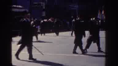 New York City (1962): Men Marching Flag Carrying Suits Sunny Day Crowd Older