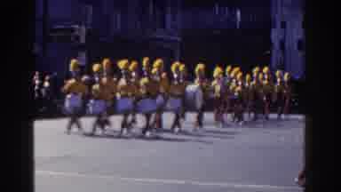 New York City (1962): Band Wearing Yellow Uniforms Marches In Parade On A Bright