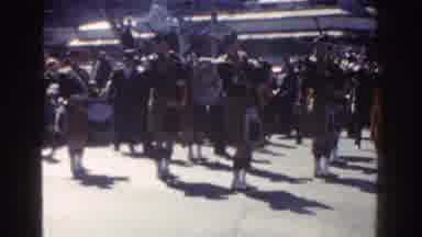New York City (1962): A Parade In A City With People Marching In Uniform And A