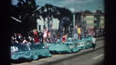 Pasadena California (1962): People Riding And Waving On A Big Blue Parade Float