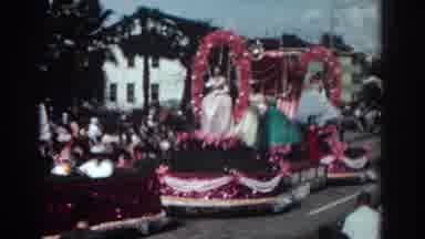 Pasadena California (1962): Women In Elaborate Dresses On Parade Float Wave To