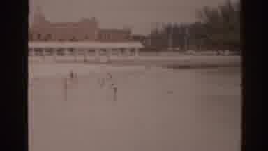 Florida USA (1963): People In And Out Of Body Of Water Near Building Or Hotel