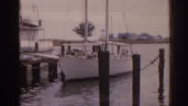 Florida USA-1963: Sailboat Docked At Marina On A Serene Day