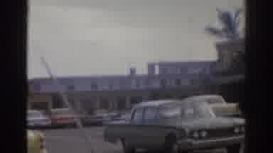 Florida USA (1963): Old Car In A Old Movie With Walkers Crossing The Avenue And A