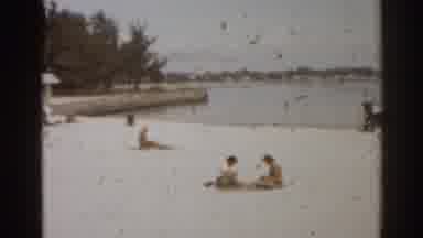 Florida USA (1963): People Lounging On The Shore On A Sunny Day At The Lake