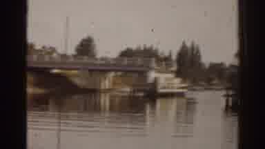 Florida USA (1963): Boat Parked Along Calm River With Bridge