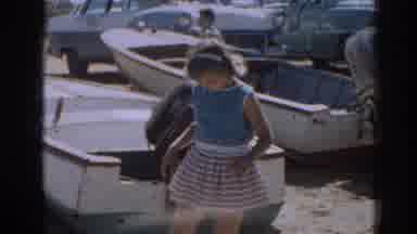New Jersey USA (1963): Young Girl Near Boats Looking At A Sailboat