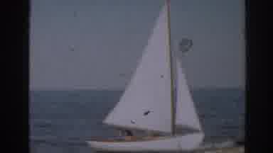 New Jersey USA (1963): View Of White Sailboat And Girl Wearing Blue Swimwear