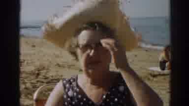 New Jersey USA (1963): Woman At Beach Talks To Cameraman And Smokes A Cigarette