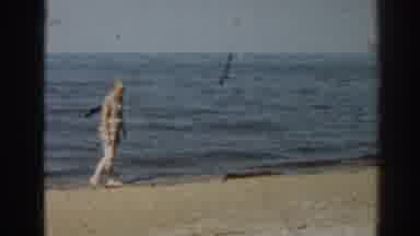 New Jersey USA (1963): Beach Oceanfront Walking Waves Elderly Woman In Hat Sand