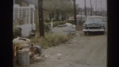 New Jersey USA (1963): Old Woman Walking Through An Old Town