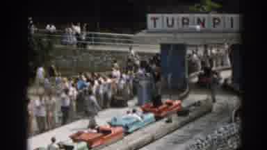 New Jersey USA (1963): Many People Watching A Line Of Cars Waiting To Pass The